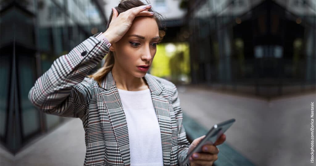 stressed businesswoman after taking a business call