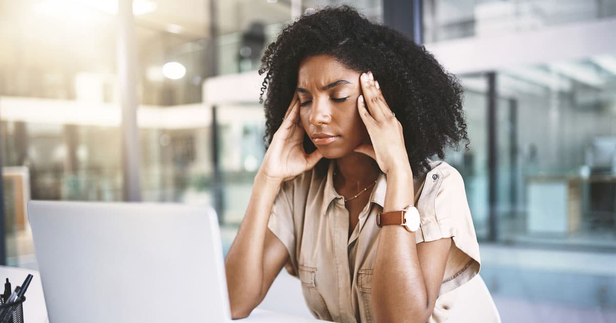 black business woman fatigued while at work