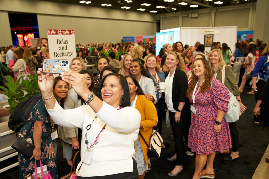 attendees taking a group selfie at the TX Conference for Women